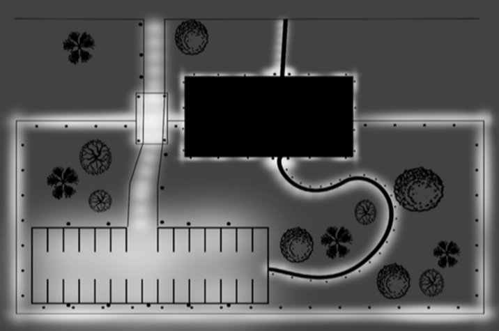 Une installation avec éclairage éclairant la clôture du périmètre, l'entrée des véhicules, la passerelle piétonne, l'aire de stationnement et le bâtiment