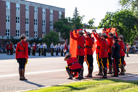 The ceremonial lowering of the Canadian flag at sunset.