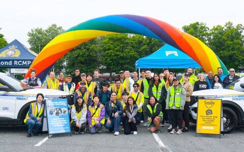 Richmond RCMP officers, volunteers, and partner agencies standing together