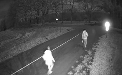 Image from a surveillance camera showing migrants crossing the border into Canada illegally