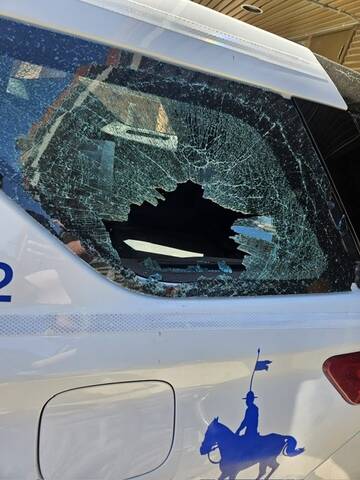 The window of a police cruiser vehicle was broken when a suspect being arrested head butted it on May 23.