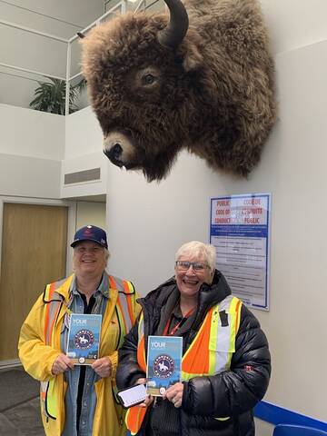 Community Policing volunteers with Lock it or Loose it brochure