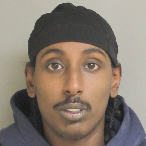 Male with brown eyes and hair wearing a black hat | Homme aux yeux et aux cheveux bruns portant un chapeau noir