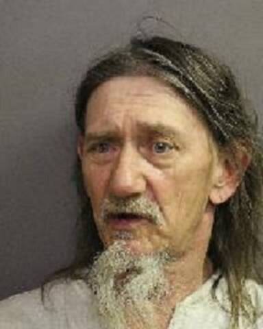 Brent Kelm with a scruffy grey beard and long hair.