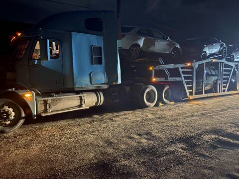 This tractor unit was removed from the road for safety violations. The attached trailer was carrying vehicles that were not properly secured