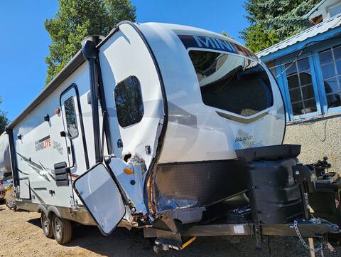 Thumbnail: A white RV trailer that was being towed by a pickup that was involved in a fatal collision in Fanny Bay