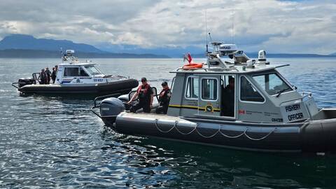 An RCMP vessel and a DFO vessel on the water