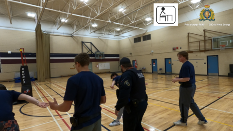 Photo of the students learning handcuffing procedures