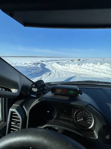 A Saskatchewan RCMP Traffic Services officer leaves Stoney Rapids to begin his patrol of the ice road.