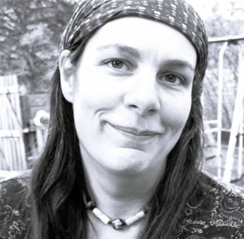 A black and white image of Jennifer Provencal wearing a headband outdoors