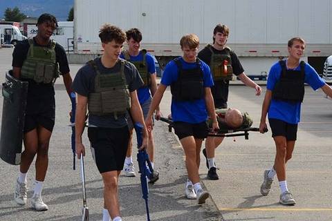 Members of the Heat volleyball team rescuing a hostage during a training session