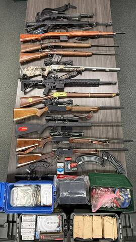 Twelve firearms and roughly 2,000 rounds of ammunition were seized from the residence.