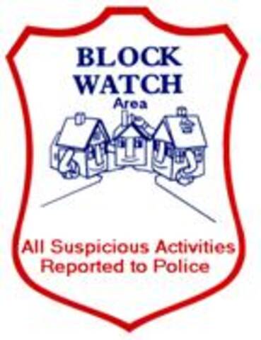 Panneau Block Watch Area (secteur Block Watch) indiquant que « toute activité suspecte sera signalée à la police »