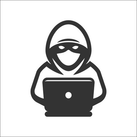 Image de dessin animé d'un méchant tapant sur un ordinateur portable.