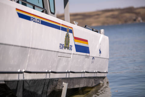 Image of Saskatchewan RCMP boat, displaying RCMP crest in a body of water